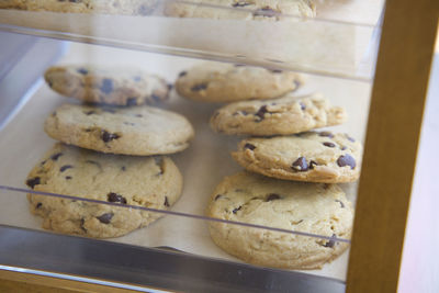 High angle view of chocolate chip cookies on display in a coffee shop