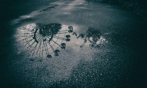 High angle view of wet bicycle on road