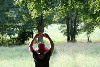 Rear view of man standing on field