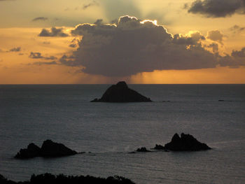 Scenic view of sea against sky at sunset