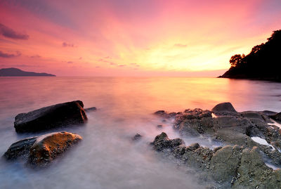 Scenic view of sea against sky during sunset