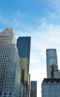 Low angle view of buildings in city against sky