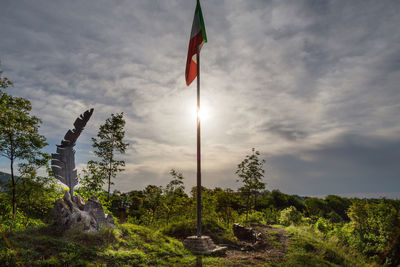 Low angle view of flag against sky