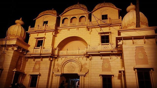 architecture, built structure, building exterior, low angle view, arch, window, statue, facade, sculpture, night, art and craft, human representation, art, history, architectural column, building, no people, ornate, outdoors, sky