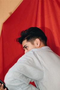 Portrait of young man lying down