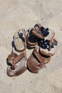 High angle view of shoes on sand