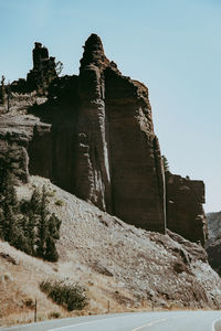 Low angle view of castle on mountain against sky