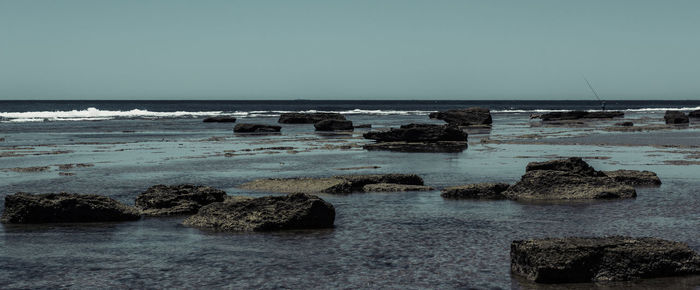 Scenic view of sea against clear sky