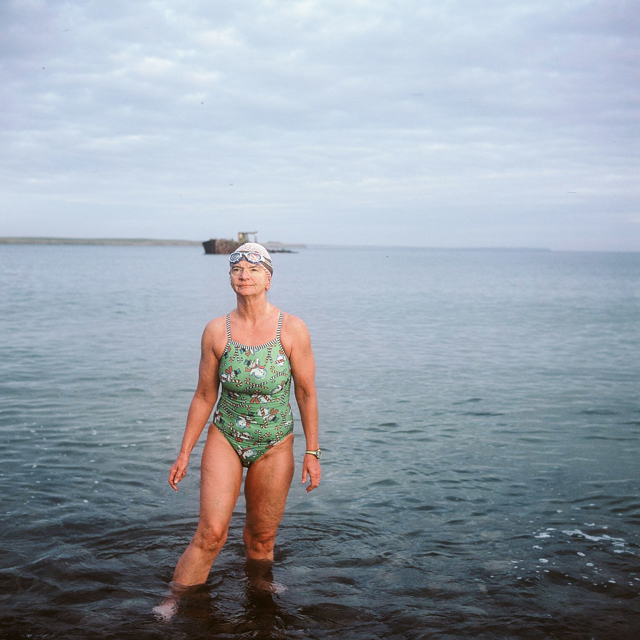 sea, water, one person, nature, sky, standing, real people, outdoors, leisure activity, horizon over water, smiling, beauty in nature, day, happiness, lifestyles, looking at camera, portrait, full length, scenics, young adult, adults only, adult, people