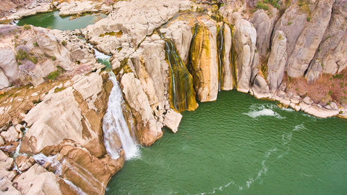 High angle view of rocks in sea