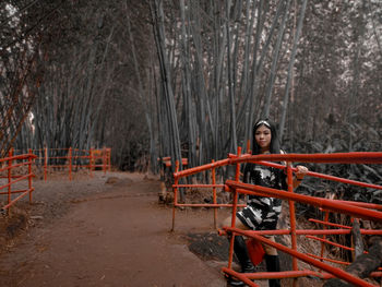 Portrait of young woman in forest