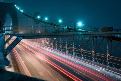 Light trails on suspension bridge at night