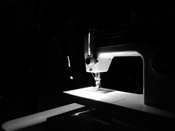 Retro sewing machine in darkness