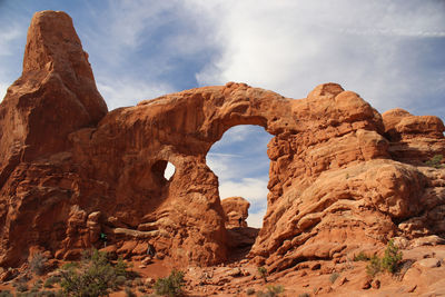 Low angle view of rock formation against sky