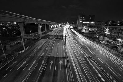 High angle view of light trails on highway at night