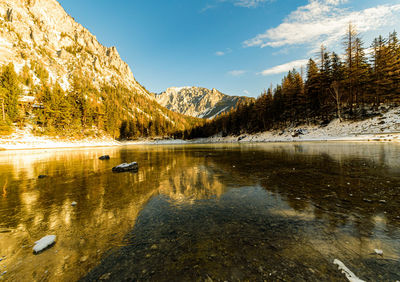 Scenic view of lake by trees against sky. green lake in styria, austria