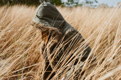 Woman walking on grassy field