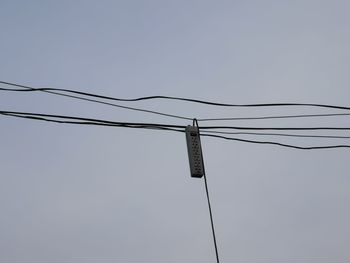 Low angle view of street light against sky