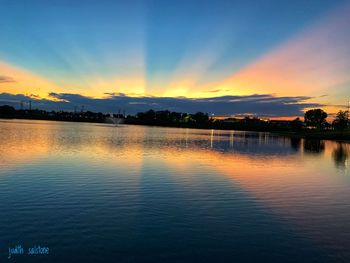Scenic view of lake against sky during sunset