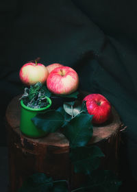 High angle view of apples and fruits against black background