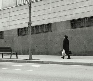 Silhouette of woman in city