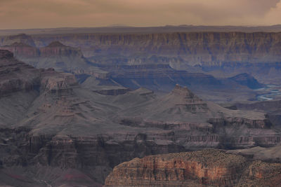 Aerial view of landscape with mountain range in background