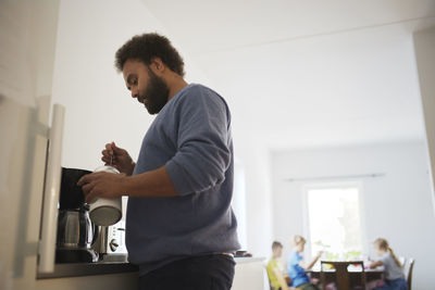 Man making coffee at home