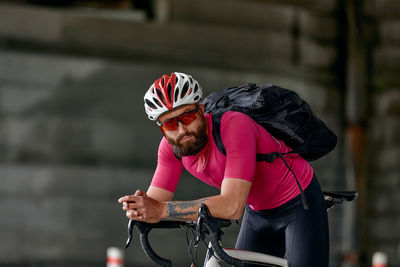 Rear view of man riding bicycle