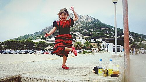 Full length of a girl playing on the beach