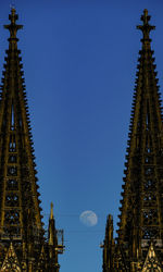 Low angle view of buildings against blue sky