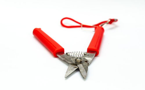 High angle view of traditional equipment against white background