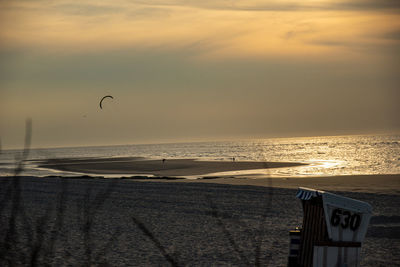 Scenic view of beach against sky during sunset