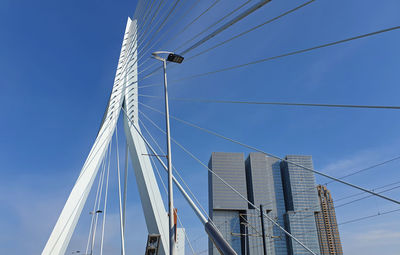 Low angle view of modern building against clear blue sky