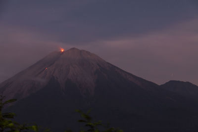 Scenic view of volcanic mountain against sky