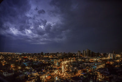 High angle view of illuminated city buildings against sky