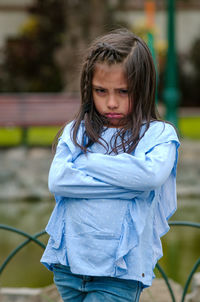 Portrait of cute girl standing outdoors