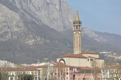 Buildings in town against sky
