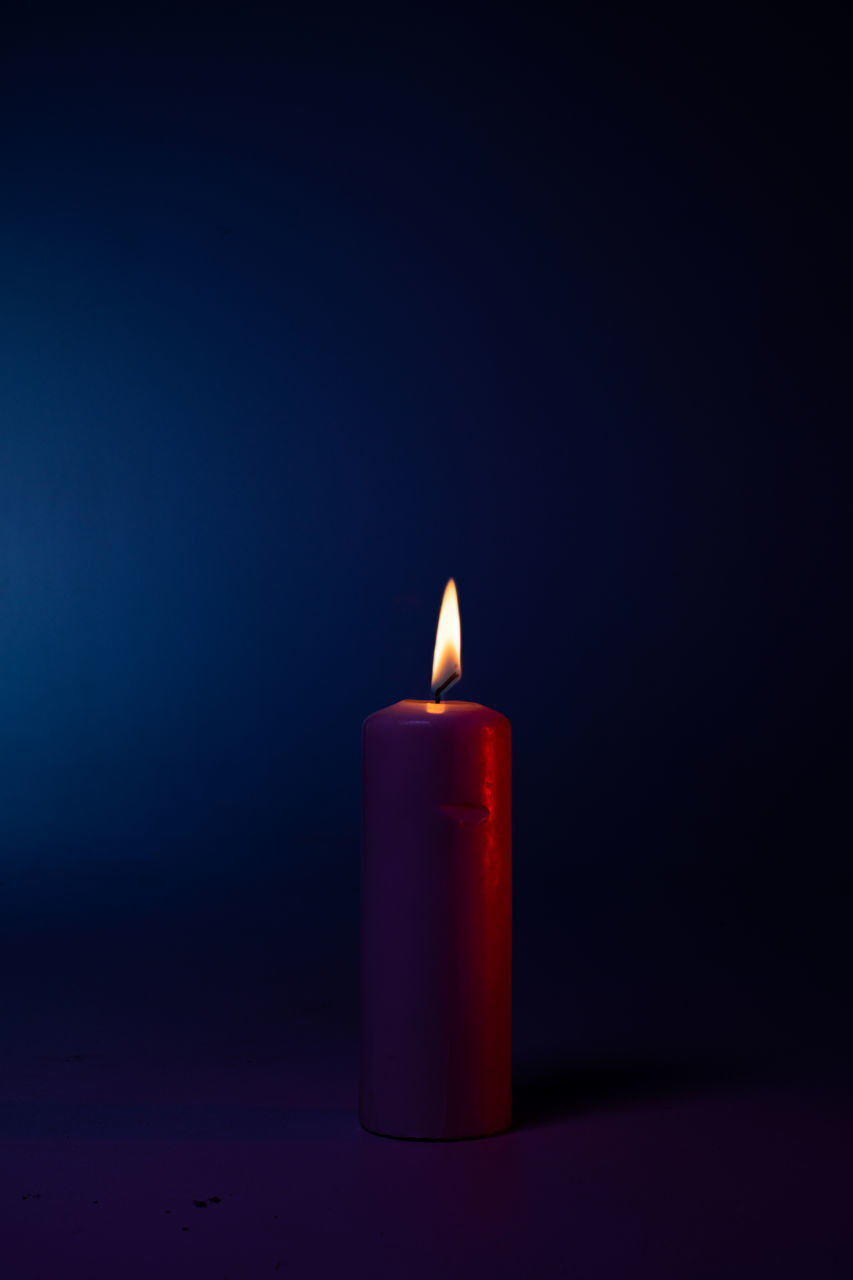 burning, fire, candle, flame, flameless candle, heat, cylinder, studio shot, indoors, lighting, illuminated, darkness, no people, dark, single object, nature, light, glowing, copy space, close-up, red, wax, still life photography, black background, lighting equipment