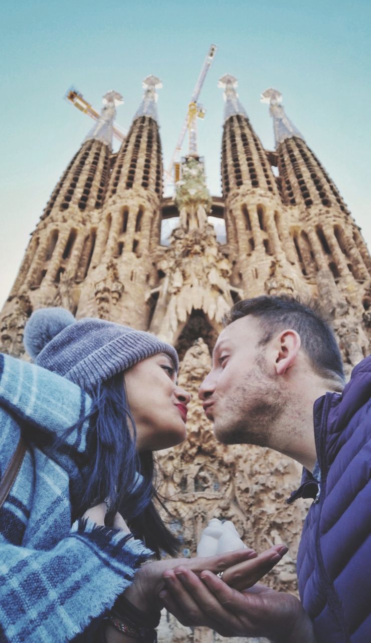 togetherness, architecture, two people, real people, lifestyles, travel destinations, love, built structure, young adult, men, positive emotion, bonding, leisure activity, emotion, young women, women, adult, headshot, young men, couple - relationship, warm clothing