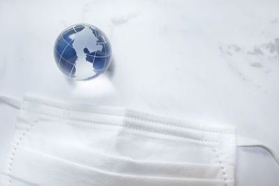 High angle view of glass on table against white background