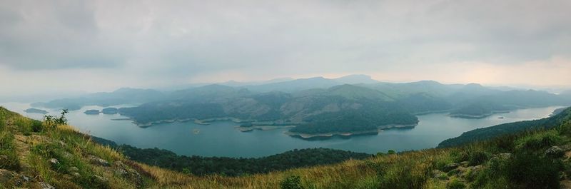 Panoramic view of lake and mountains against sky