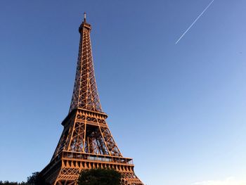 Low angle view of eiffel tower against clear blue sky