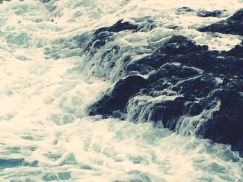 Waves splashing on rocks