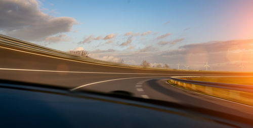 Blurred motion of highway against sky