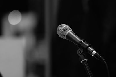 Close-up of microphone in auditorium