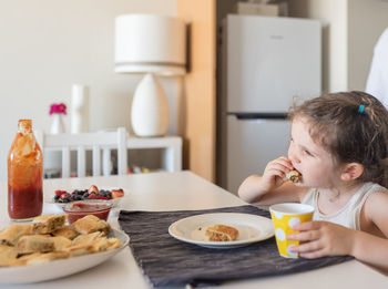 Girl having food at home