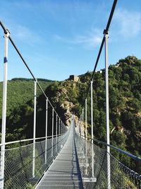 Footbridge against sky