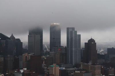 View of modern buildings in city against sky