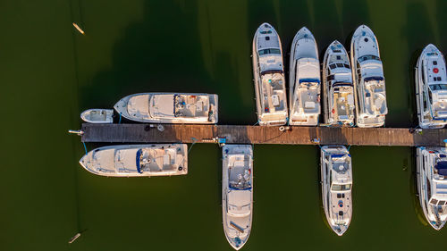 Aerial view of leisure boats at the harbor on the river sile, casier, italy, at sunset