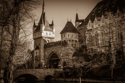 View of arch bridge and building against sky